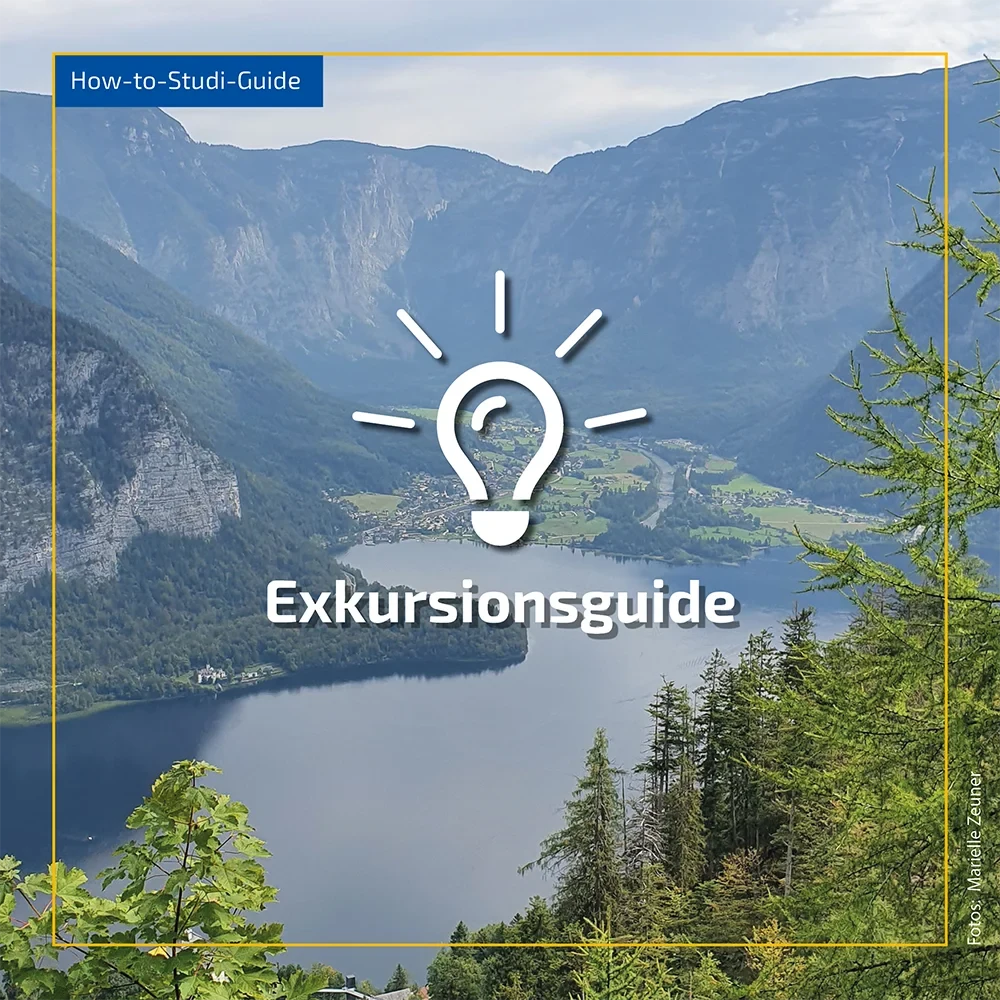 Eine Wissenschaftlerin und ein Wissenschaftler arbeiten hinter einer Glasfassade und mischen Chemikalien mit Großgeräten.