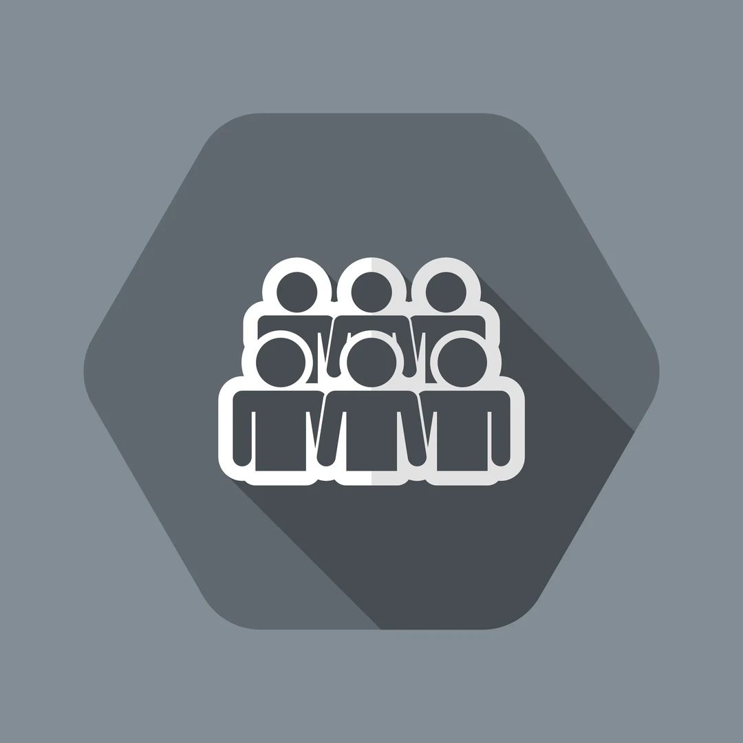 Eine Wissenschaftlerin und ein Wissenschaftler arbeiten hinter einer Glasfassade und mischen Chemikalien mit Großgeräten.